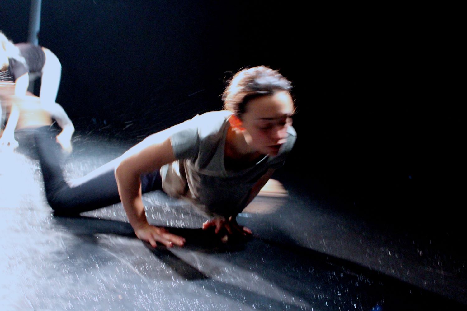 A woman sliding on a wet floor 