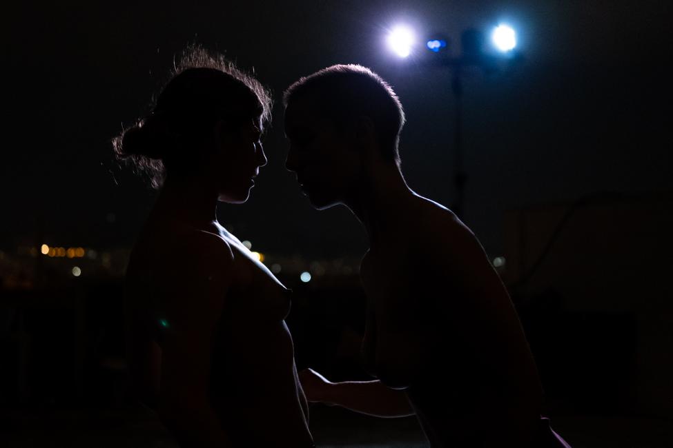 two women face each other at a close distance